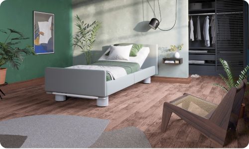 Graues Bock-Pflegebett mit grün-braunem Dekor.