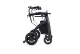 Seitenansicht des Rollz Motion Electric in zusammengeklappter Form. Der faltbare 3-in-1-Rollator und Elektrorollstuhl bietet eine kompakte Bauweise für einfachen Transport und platzsparende Aufbewahrung.